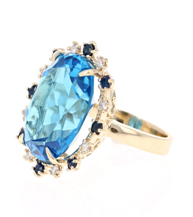 21.50 Carat Oval Cut Blue Topaz Diamond 14 Karat Yellow Gold Cocktail Ring